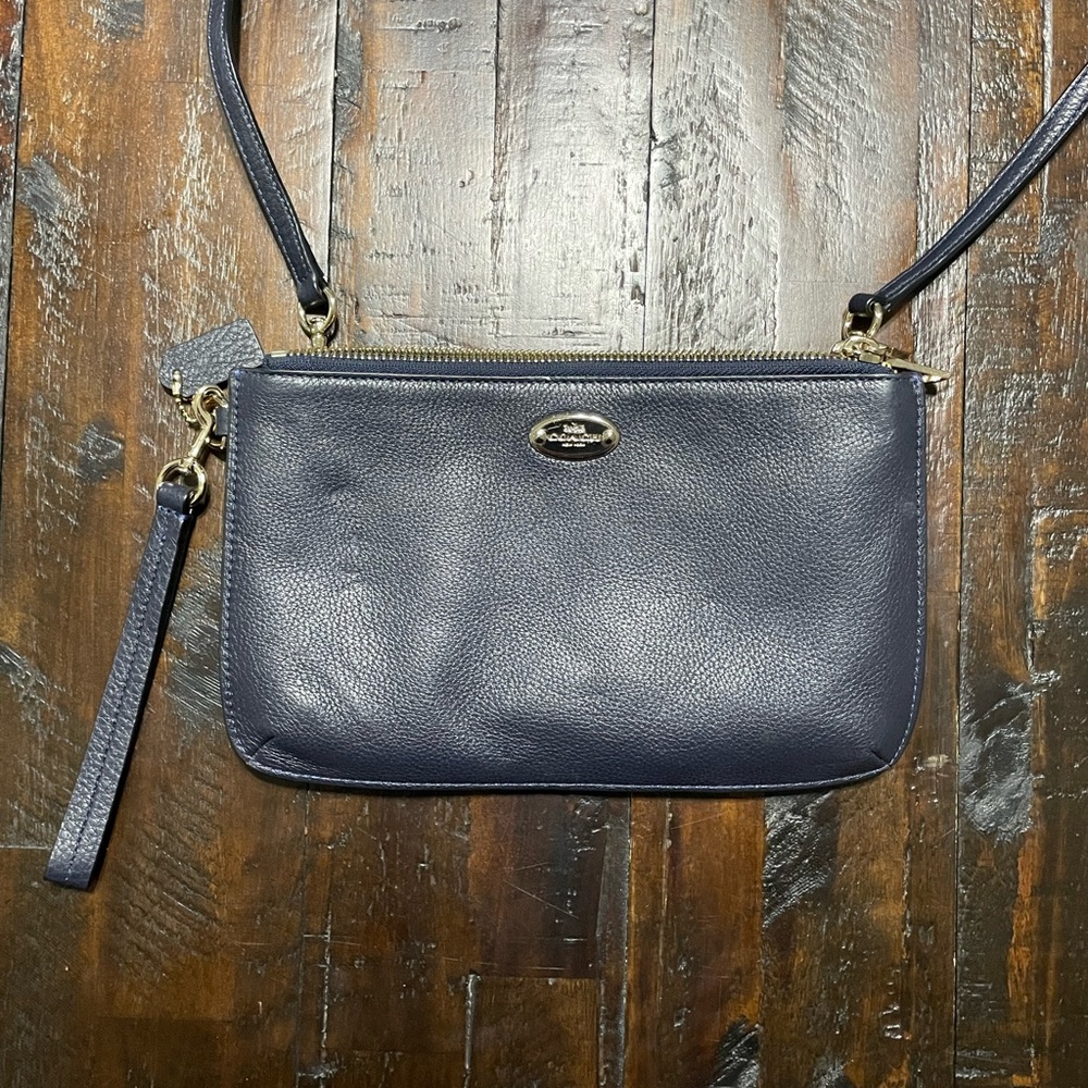 Coach Navy Blue leather crossbody/wristlet.  In like new condition.